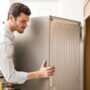 young man working as electrician exposing back fridge check repair it_662251 2712 495x323 1 1 90x90